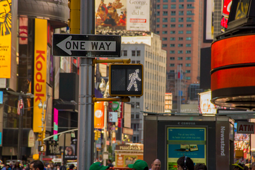 New York, USA - June 04, 2013: Men and women are crossing Canal Street at chinatown in New York.