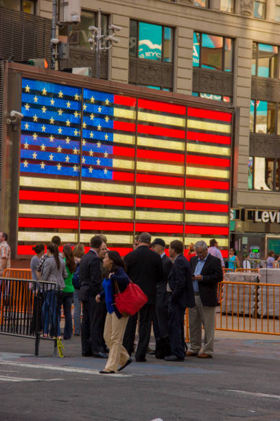 New York, USA - June 04, 2013: Men and women are crossing Canal Street at chinatown in New York.