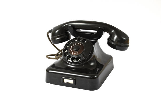 Old black rotary dial telephone stock photo