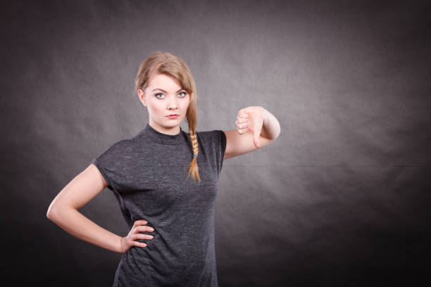 istock Sad unhappy woman with thumb down. 804786000