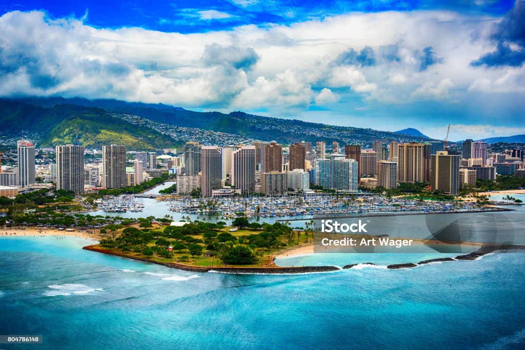 Skyline Aerial of Honolulu Hawaii The beautiful coastline Honolulu Hawaii shot from an altitude of about 500 feet during a helicopter photo flight over the Pacific Ocean. Hawaii Islands Stock Photo