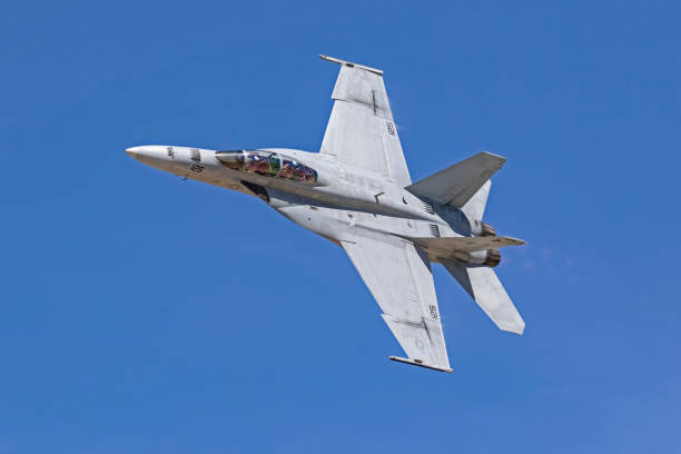 airpalne f-18 hornet jet fighter flying at the air show - military airplane mcdonnell douglas fa 18 hornet military fighter plane imagens e fotografias de stock