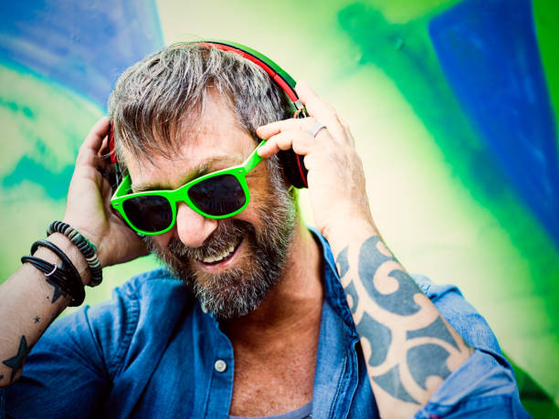 istock Portrait of mature man, graffiti on background 804805400