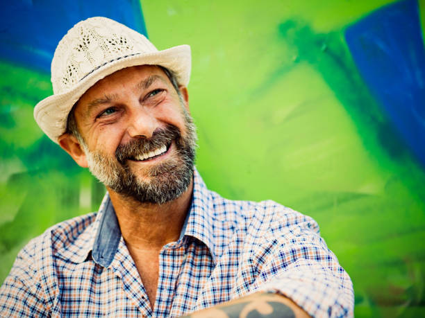 istock Portrait of mature man, graffiti on background 804806780