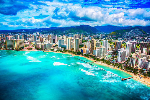 The beautiful coastline of the Waikiki area of Honolulu Hawaii shot from an altitude of about 1000 feet during a helicopter photo flight over the Pacific Ocean.