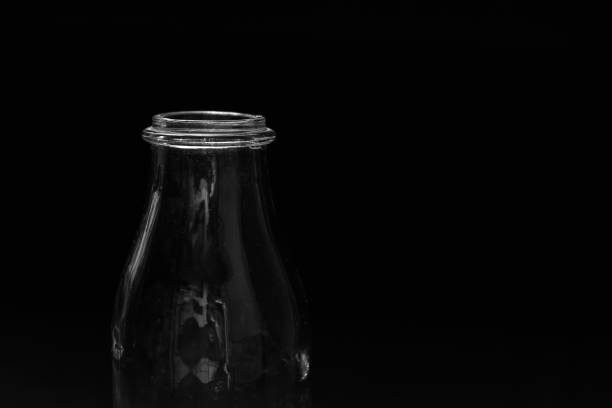 Bottle of milk on a black background