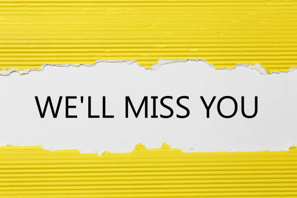 istock The text We'll Miss You appearing behind torn paper 804827274