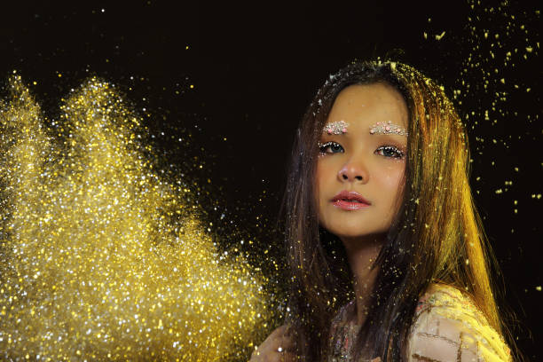 istock Woman with Gllitter Snowflake in dark background 804827400