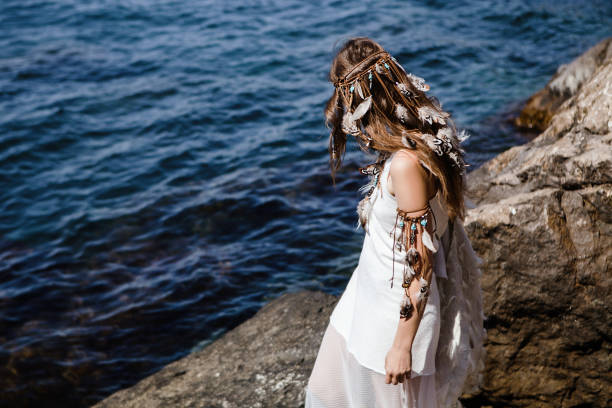 istock beautiful boho girl standing on a seashore 804833122