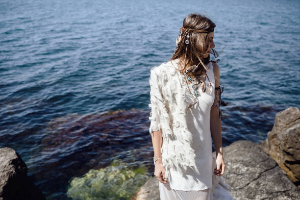 istock beautiful boho girl standing on a seashore 804833142