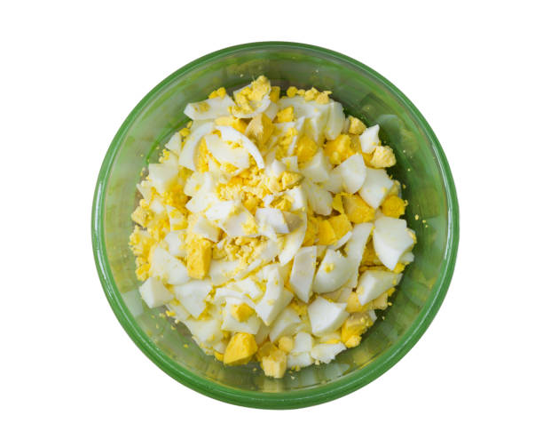 istock finely chopped boiled eggs in a green bowl  isolated on white background. close-up, top view, tinted photo 804838184