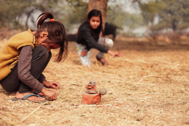 Two cute little girls playing  outdoor in the nature.
