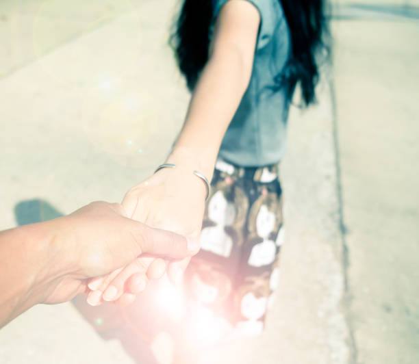 istock Loving couple holding hands and walking together with color filter effect. 804846672