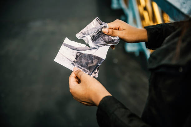 istock Tearing Photo Torn Apart Breakup Sadness Concept 804860156