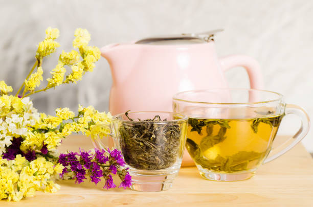 istock Cup of hot tea on wooden table 804875392