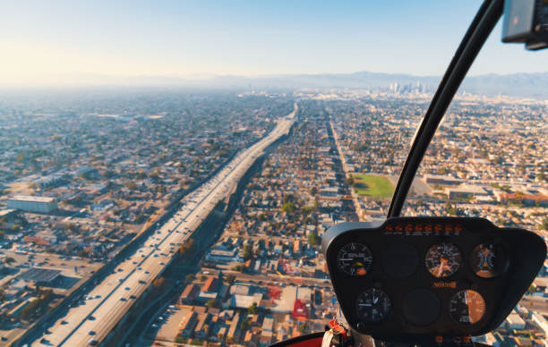 istock View through the windshield of a helicopter above LA 804876110