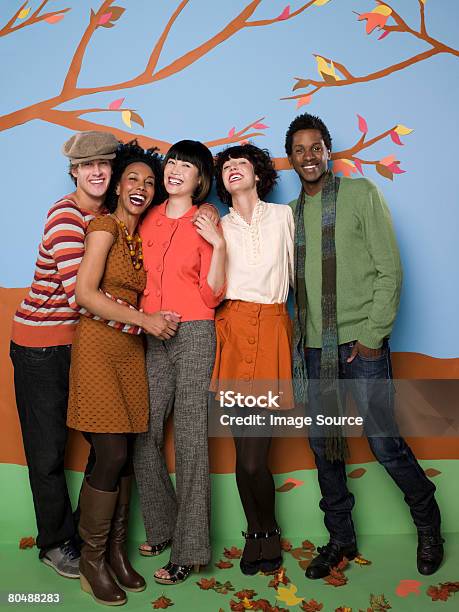 Friends In Autumn Stock Photo - Download Image Now - Group Of People, Women, Backdrop - Artificial Scene