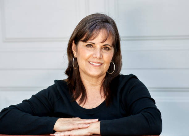 istock Middle Aged Woman Smiling at Camera 804886122