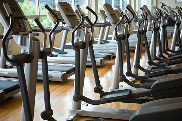 Treadmills in a row  exercise machine stock pictures, royalty-free photos & images