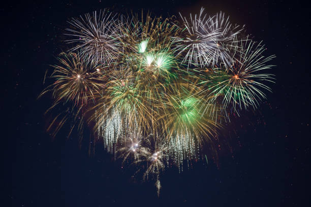 istock Sparkling golden green celebration fireworks 804895832