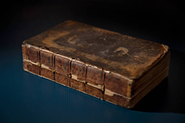 An Antique Broken Book on a Table, Possibily a Bible
