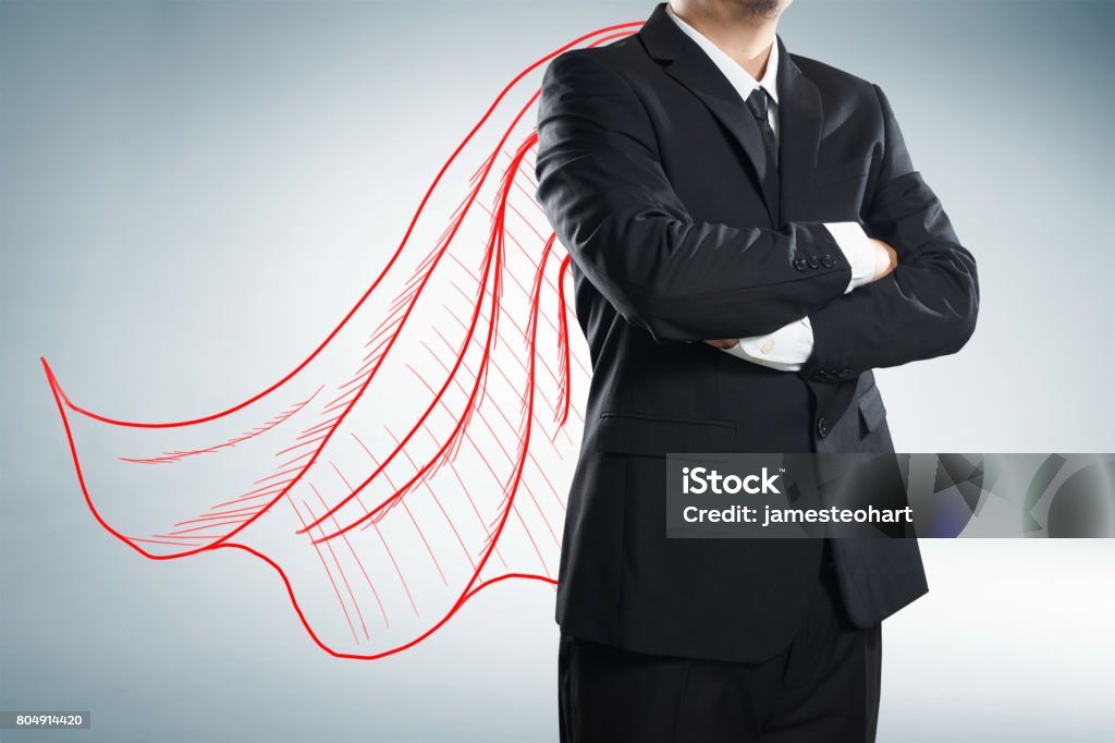 Businessman with drawn red color cape. the concept of success, leadership and victory in business. Superhero Stock Photo