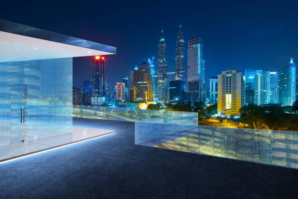 istock Kuala Lumpur skyline at night with balcony view . 804914556