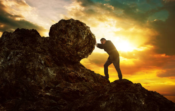 istock Business man pushing large stone up to hill , Business heavy tasks and problems concept. 804914564