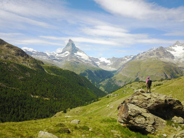 Success - Female hiker standing on a rock Summer, Activity, Hands in air, Switzerland, Zermatt, Matterhorn matterhorn stock pictures, royalty-free photos & images