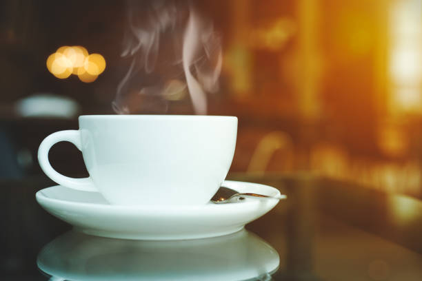 istock cup of coffee and smoke on table in cafe 804928454