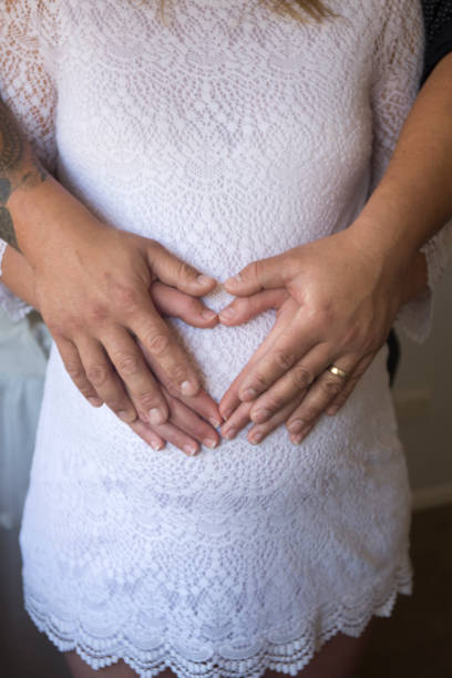 istock expecting a baby as a couple with a heart shape 804928562