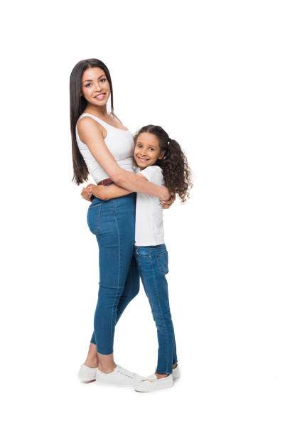 istock mother and daughter looking at camera while hugging each other isolated on white 804933966