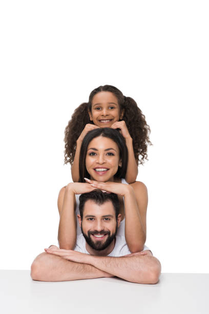 istock Happy multiethnic family leaning at white table and smiling at camera 804934914