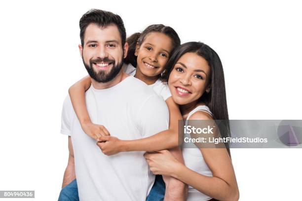 Man And Daughter Piggybacking While Woman Standing Near By Isolated On White Stock Photo - Download Image Now