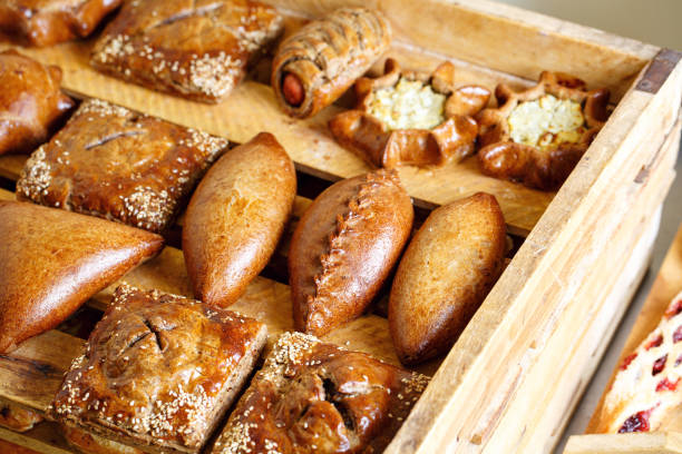 istock Freshly baked bread and puffson tray. 804940734