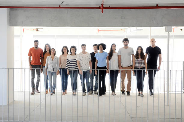 istock Group of enthusiastic business people walking 804955620
