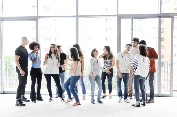 istock Group of enthusiastic business people walking 804955796