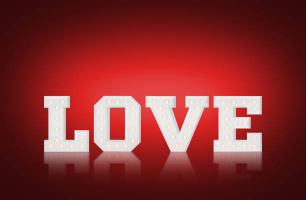 Big illuminating love letters on red background