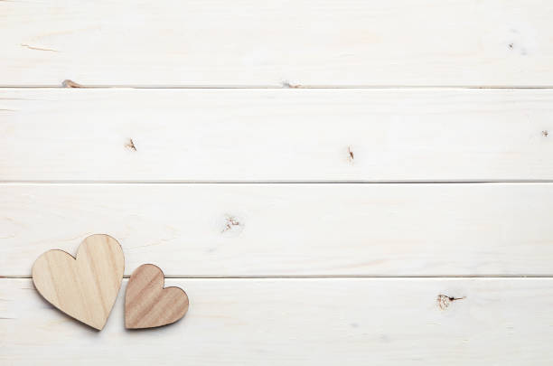 istock Hearts on wooden background 804989026