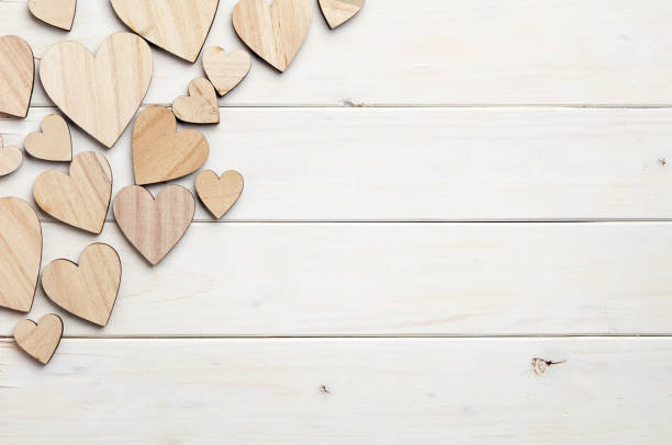 istock Hearts on wooden background 804989074