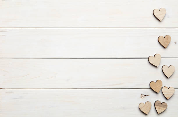 istock Hearts on wooden background 804989166