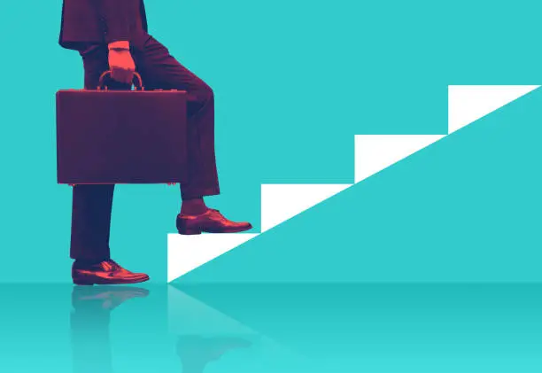 Photo of Businessman holding briefcase walking on graphic stair, start up business concepts.