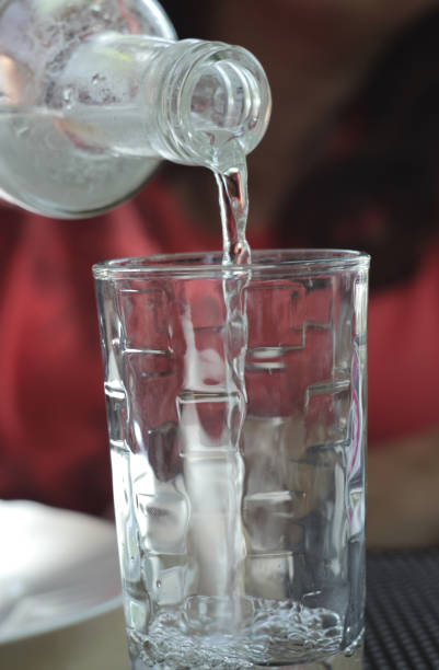 istock Pour drinking water into the glass 804999864