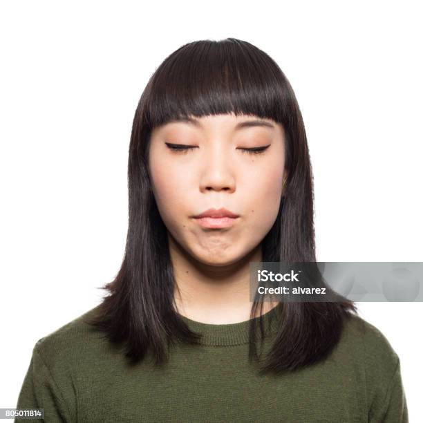 Portrait Of Young Japanese Woman With Eyes Closed Stock Photo - Download Image Now - Eyes Closed, Japanese Ethnicity, Women