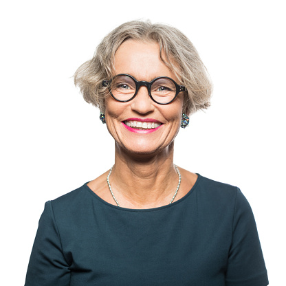 Portrait of smiling senior woman with eyeglasses isolated on white background