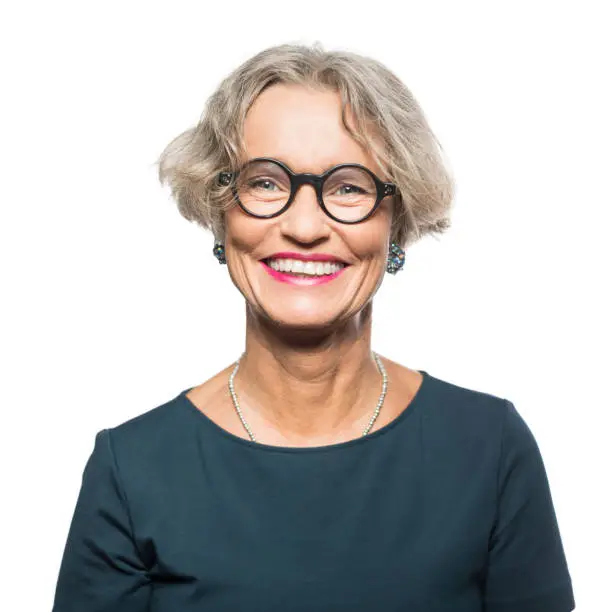 Photo of Portrait of smiling senior woman with eyeglasses