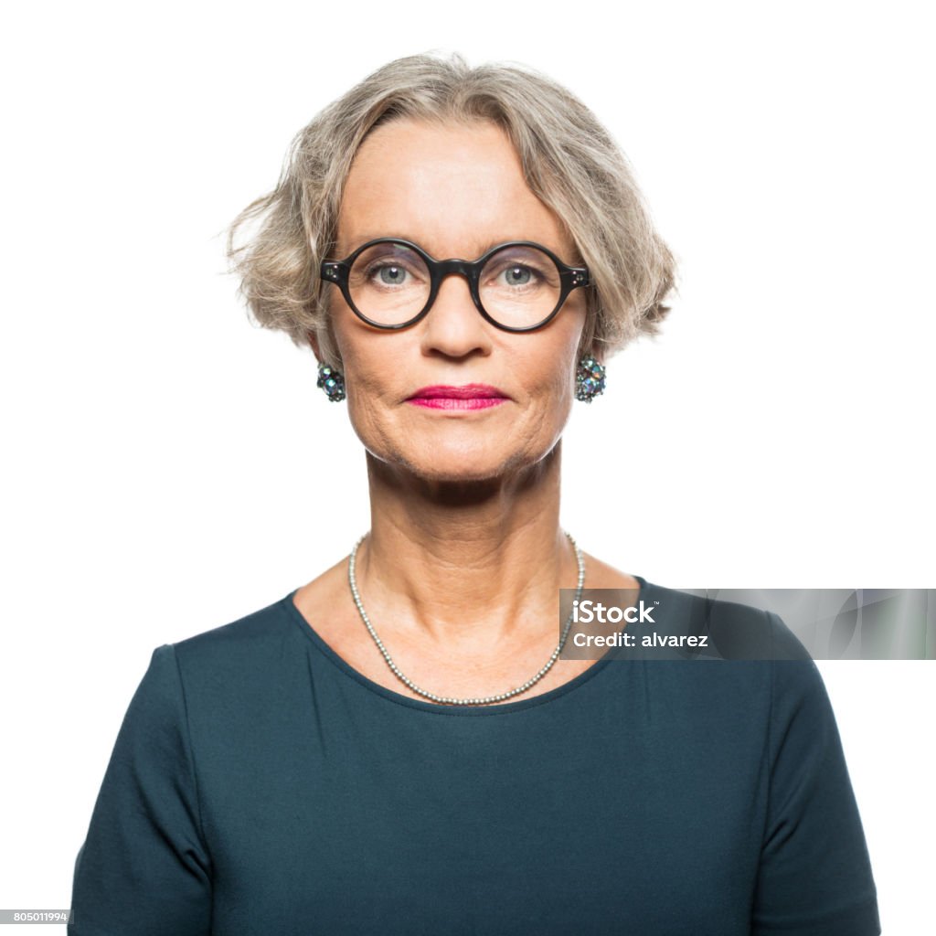 Portrait of serious senior woman Portrait of serious senior woman with glasses against white background Portrait Stock Photo