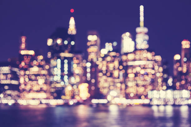 istock Blurred vintage toned Manhattan waterfront skyline at night, NYC. 805012936