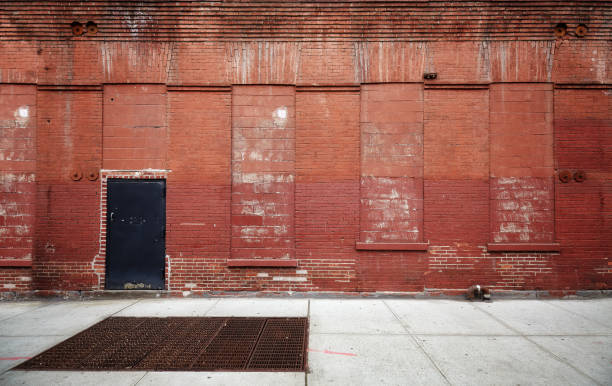 Empty street with old warehouse brick wall. Empty street with old warehouse brick wall, industrial background, New York, USA. brooklyn new york photos stock pictures, royalty-free photos & images