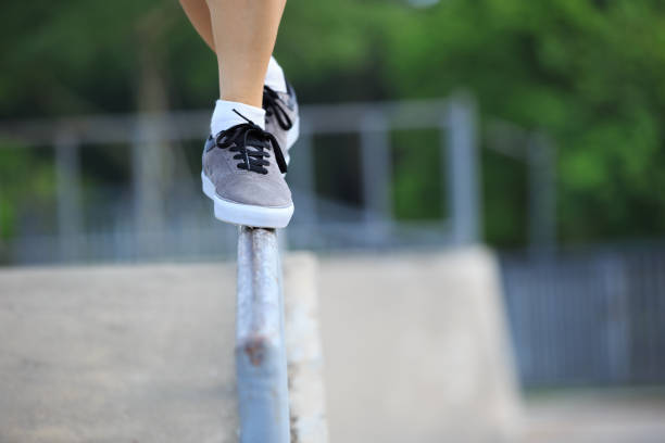 istock legs walking on steel pipe with balance 805015468